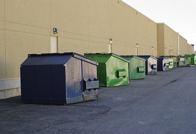 construction dumpsters stacked in a row on a job site in Green Valley